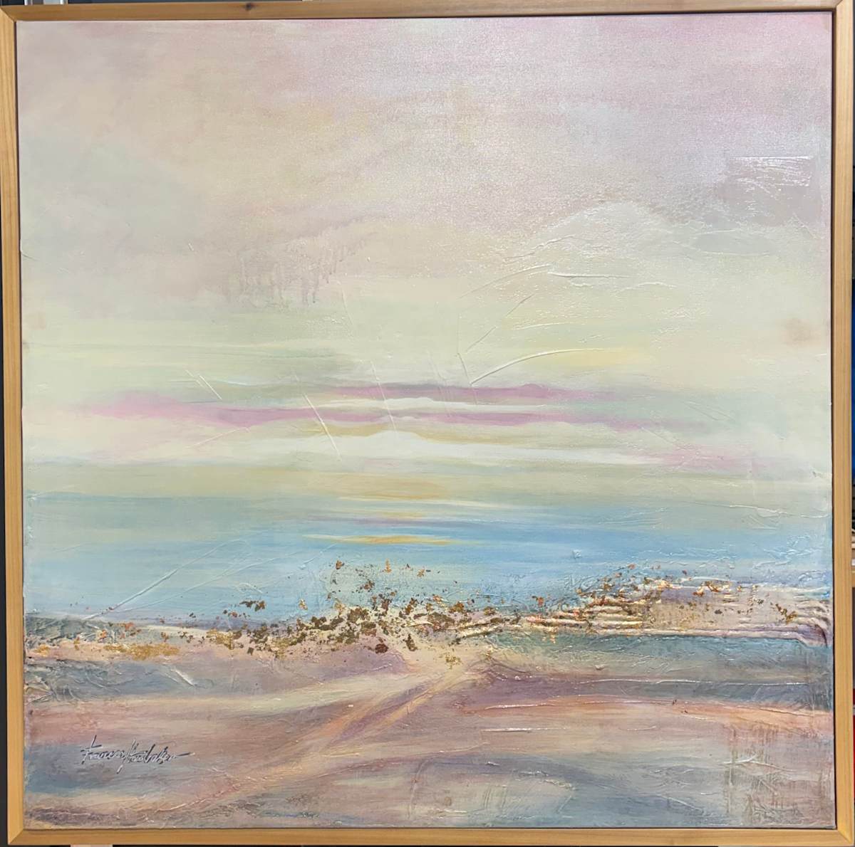 Inspired by that otherworldly phenomenon when Saharan dust drifts across the Atlantic, softening the light over the Gulf, the painting is built in whisper-thin washes of pale aqua, seafoam, blush pink, and pearl white, layered to create immense depth and stillness. The lower third grounds the ethereal atmosphere — textured, impasto sands flecked with copper, gold, and bronze leaf, catching the light like sun on wet beach. There is a quiet drama here: wind-scratched lines, faint lilac cloud bands, and a sense of vast, breathable space. At 36 x 36 in its light wood float frame, it feels both monumental and meditative — a memory of light, dust, and distant shores.