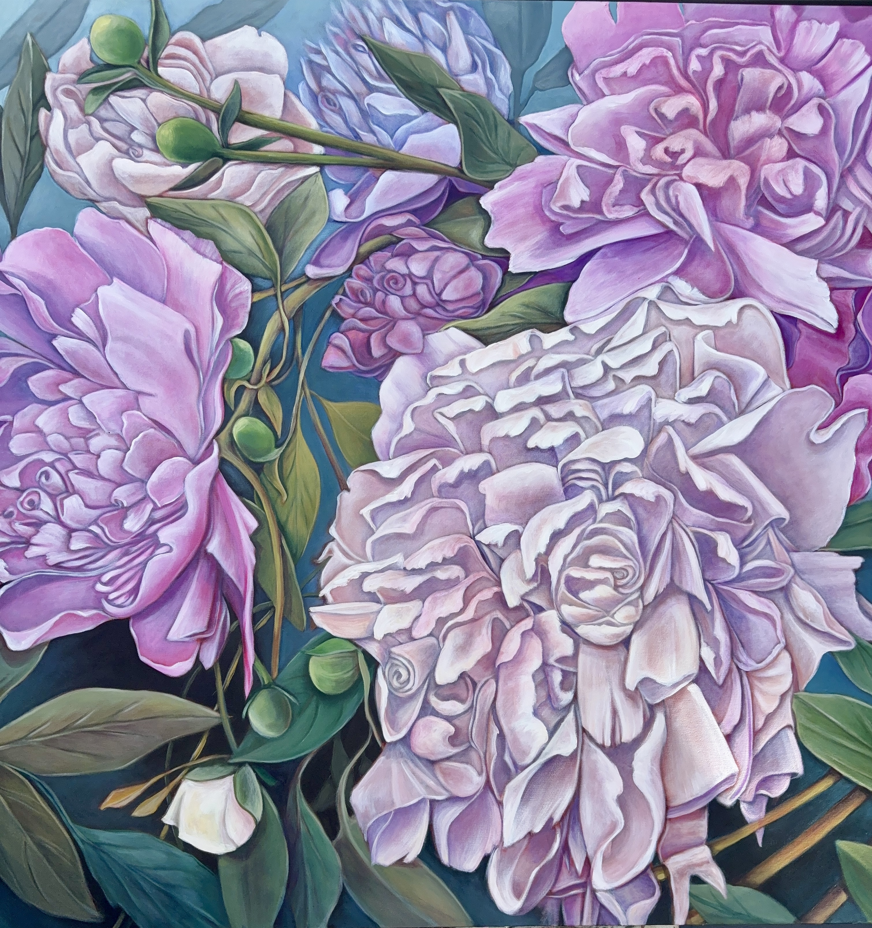 The garden has multiple meanings to me. 
It is my escape. When I paint for hour after hour, the world goes quiet and I am just there, discovering each floral petal. My favorite time to paint is 4 a.m. The house is silent. My world is silent. The daylight is just beginning to break and the canvas is waiting. That is when the garden speaks loudest.

I look at each blossom individually, closely. The shape of one petal leaning into the next. How they touch, how they curl, how they hold each other up. That interaction — that is where the magic is. If you get close enough, you can feel it.
The colors are never the same. Never. From 4 a.m. to noon to dusk to moonlight, the same peony changes completely. The sun moves, the moon moves, and the garden reinvents itself. That is why I paint them so large — so you have to come close and see that change happening.
And the nurturing — tending a garden reminds me of raising my three grown children. You water, you wait, you worry, you watch. You can't rush a peony. You can't rush a child. You just love them and give them light and let them become what they were meant to be.
The first photo you see is only the underpainting of Peony Parade — orange ground, a few lines, one tiny pink petal started at 4 a.m. The finished piece you see next to me is months of those early mornings, of watching, of nurturing.
This collection is my garden. It is my escape, my early morning prayer, my study of light, and my mother’s heart, all at once.
